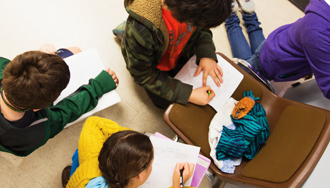 Group of children working together on assignment