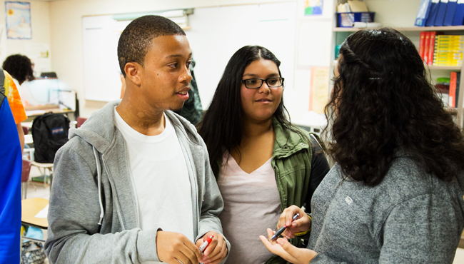 Group of adolescent students in conversation