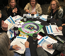 Group of teachers playing Leading Professional Learning: Building Capacity for Sustained Practice, A Simulation Game for Educators