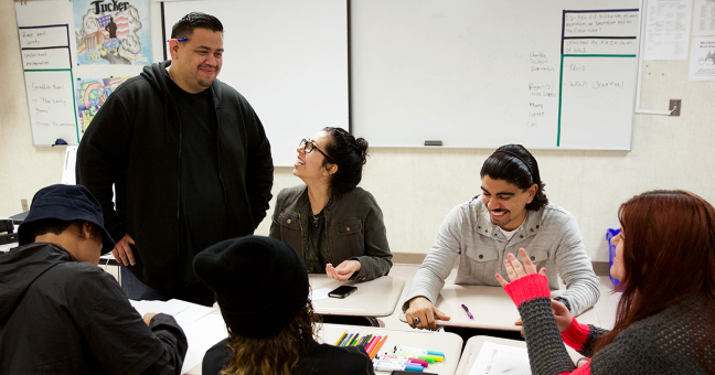 Students and teacher in high school classroom