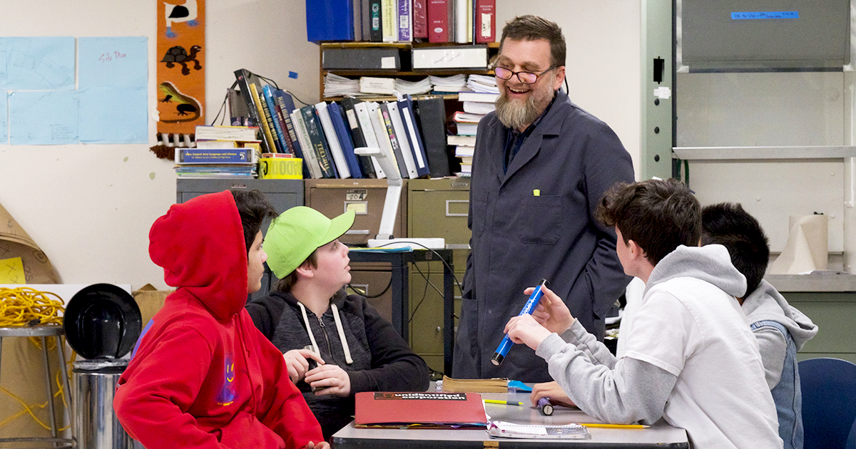 Teacher with students in a classroom