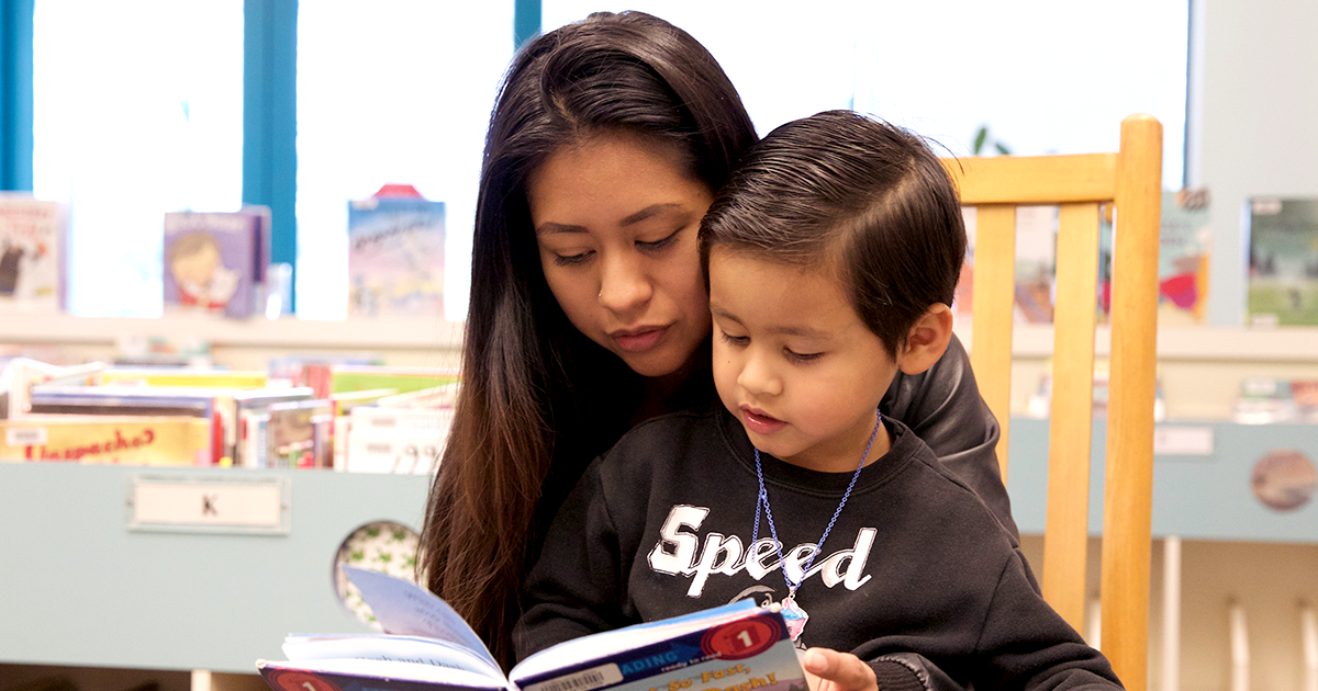 Adult reading to child