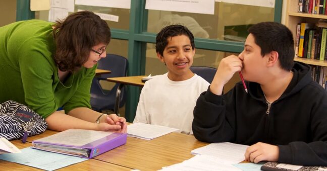 teacher talking with two students