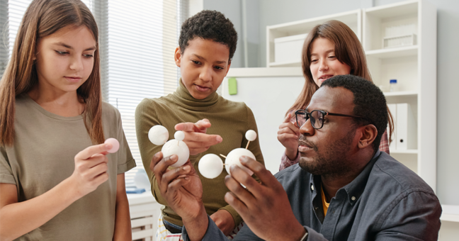 Science teacher with students