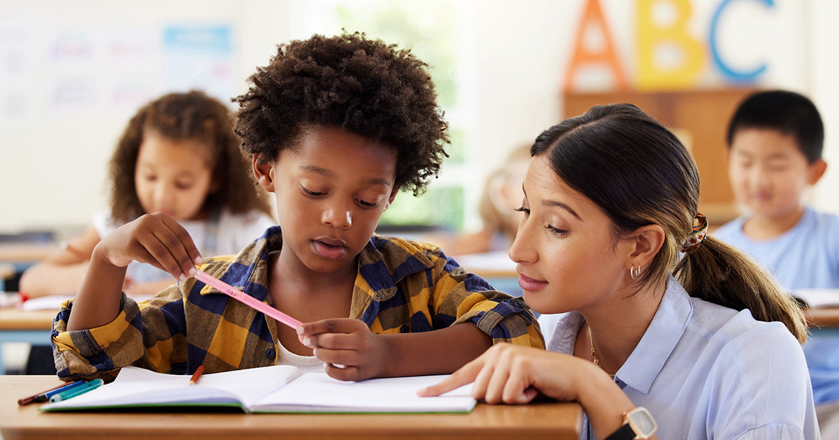 Child in classroom with teacher